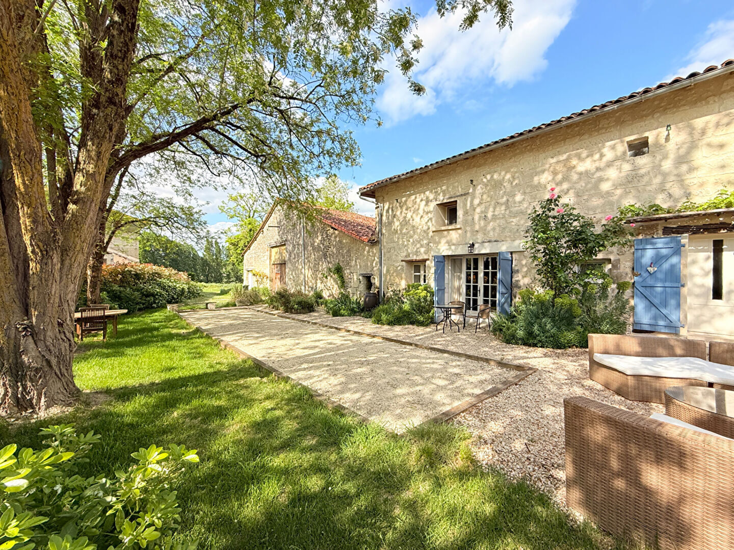 Garden with sun loungers and the house behind